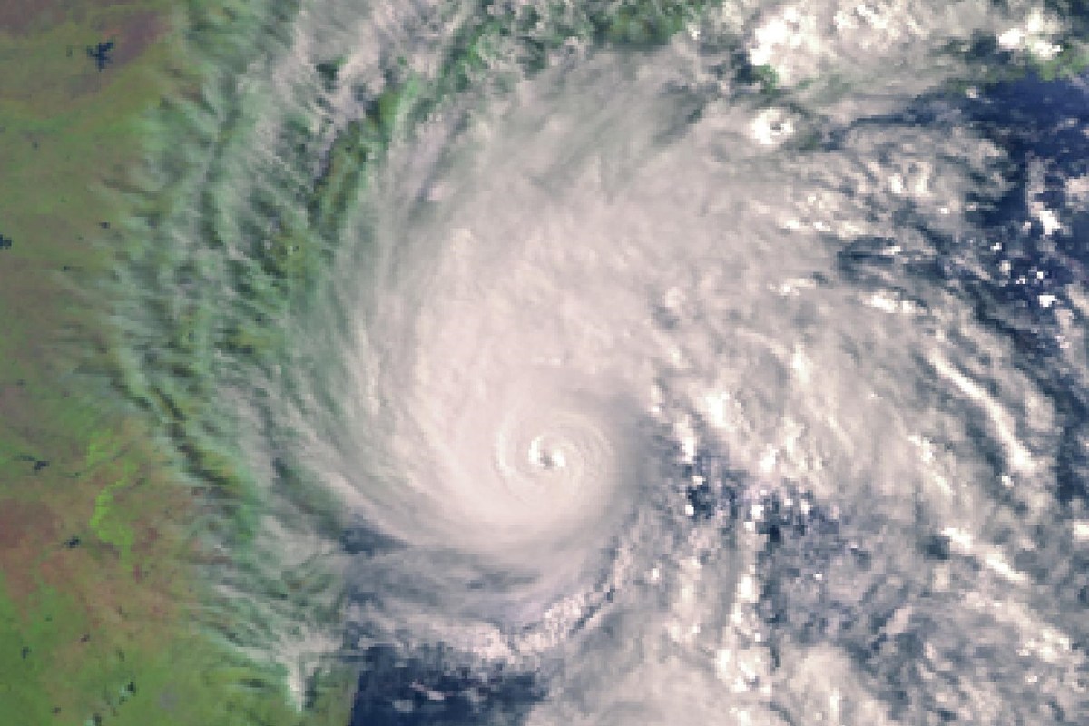 Satellite image of Cyclone Arnab, a tight white spiral of cloud with a clear eye, over the Bay of Bengal next to India’s east coast.