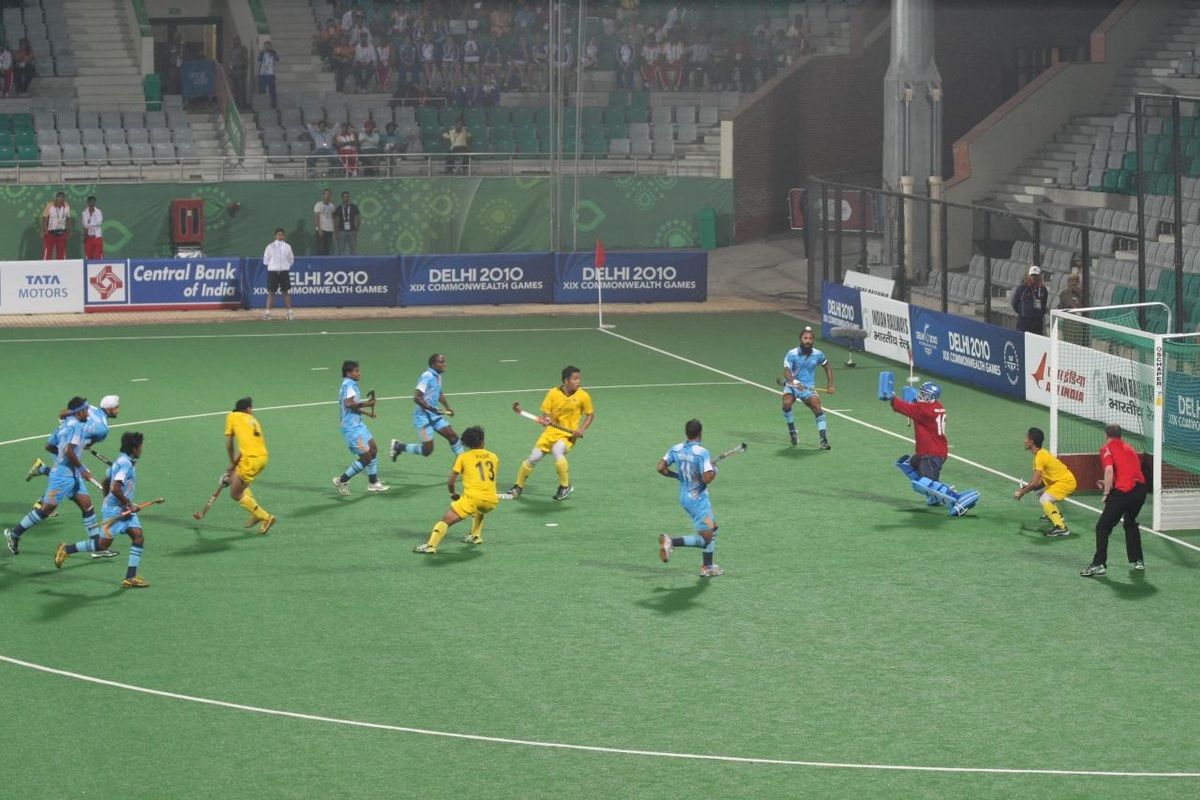 India players in blue and Malaysia players in yellow during their 2010 Commonwealth Games hockey match in Delhi.