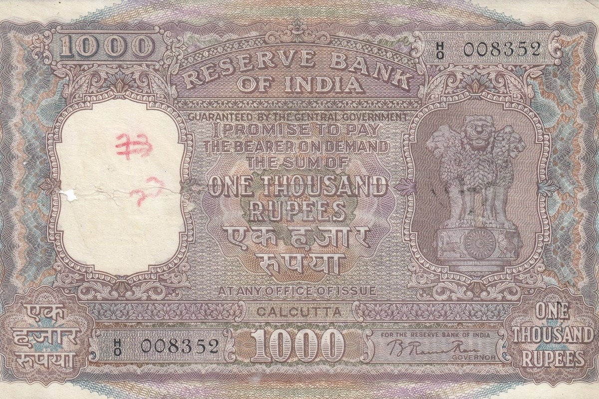 An old brown-and-grey ₹1,000 banknote issued by the Reserve Bank of India, with the Lion Capital emblem on the right and ‘One Thousand Rupees’ in English and Hindi.